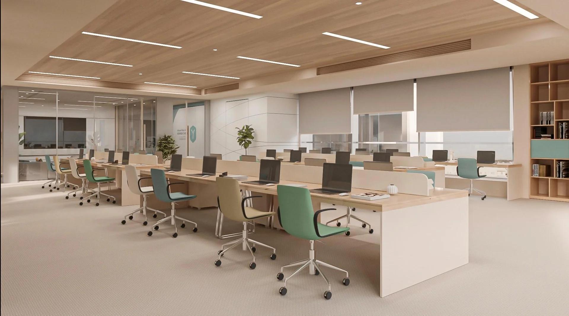 Open work area with shared desks, timber ceiling panels and pastel seating.