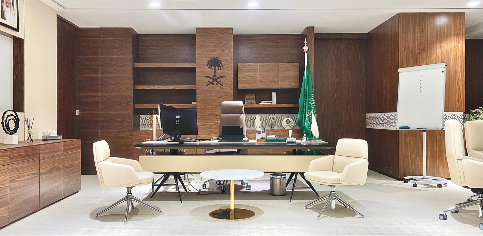 Private office with timber shelving, a large desk and a meeting table.