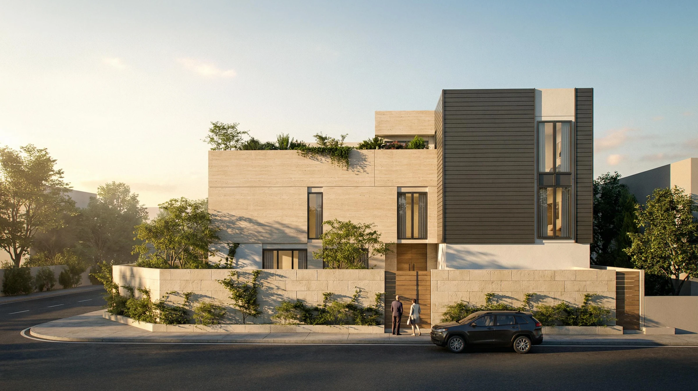 Side elevation of the villa with warm stone walls and dark facade accents.